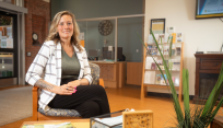 Healthcare Administration alum, Cassandra McCormack, in the Hazen Center for Integrated Care lobby.