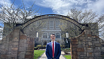 Alum, Hunter Krienke, standing outside of one of the Albany Law School buildings.