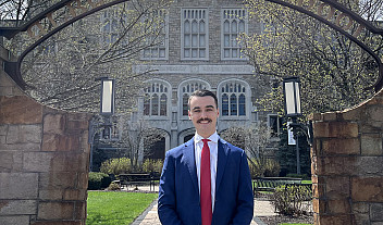 Alum, Hunter Krienke, standing outside of one of the Albany Law School buildings.