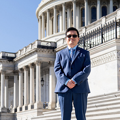 Allan Dumas standing in front of the US Capitol building.