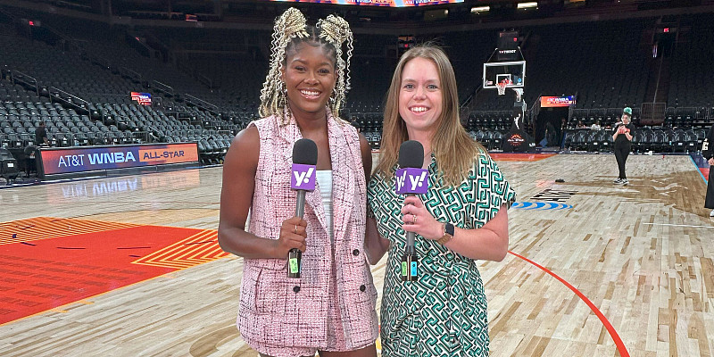 Cassandra Negley (right) reporting courtside for Yahoo Sports.