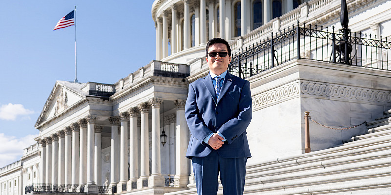 Allan Dumas standing in front of the US Capitol building.