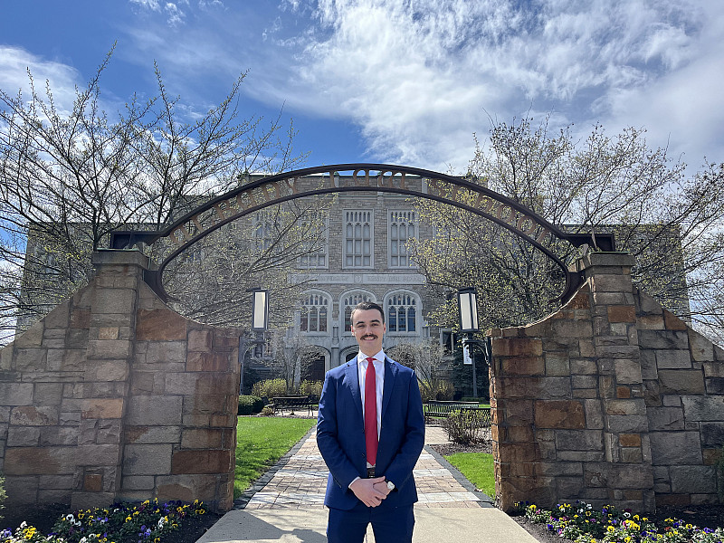 Alum, Hunter Krienke, standing outside of one of the Albany Law School buildings.