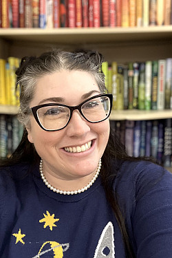 a picture of Sarah Ada - a woman wearing glasses